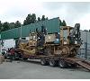 Bulldozer Catterpillar con grua HIAB Foto