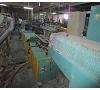 Line of extrusion of profiles P.V.C with extruder VOLCAN. Foto