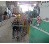Line of extrusion of profiles P.V.C. Extruder Amut 65 mm. Foto