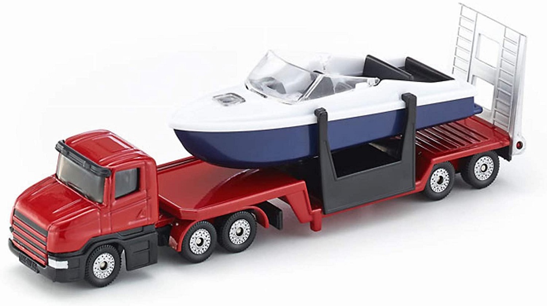 Foto de Camión de juguete con plataforma baja con barco a escala