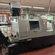 Torno tipo suizo CNC con transportador de viruta HANWHA XD 38 II-R