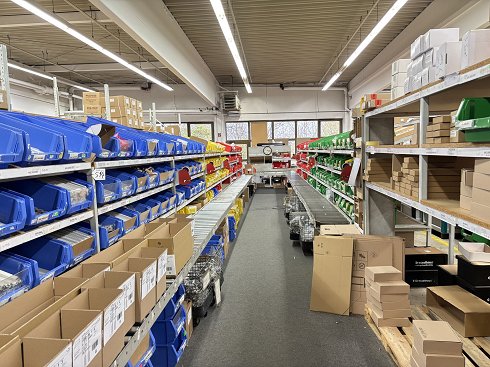 Packaging area with roller conveyor and shelves (without contents!)