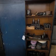 Sliding door cabinet with contents