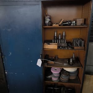 Sliding door cabinet with contents