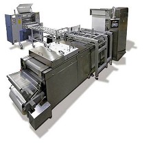 Mquina cortadora y dobladora para la produccin de compresas