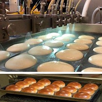 Equipo para el glaseado de huevo en bollera