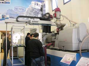 Netstal showed a fuel transfer fully electric Elion1200 with a CNC robot and feeder of Wittmann