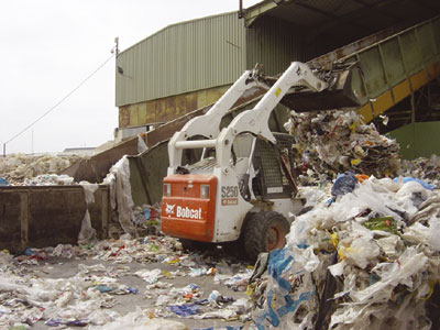 Compact wheel loader Bobcat S250 working at the plant for recycling of Denplax in Almera