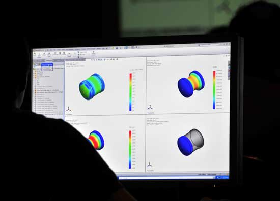 Graphics of deformation and stress of a receptacle obtained with SolidWorks Simulation...