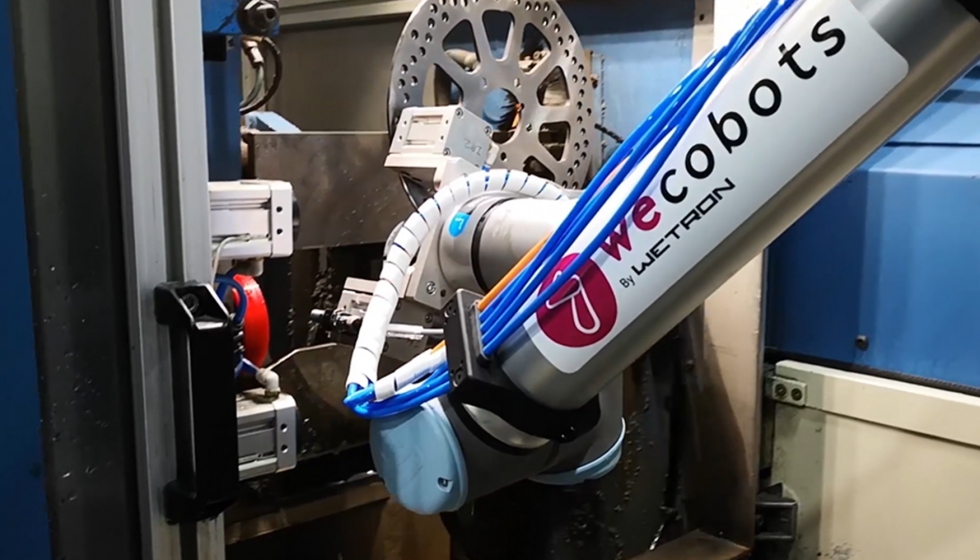 La solucin de WECOBOTS en NG Brake est compuesta de una una bancada, un cobot UR10e y una garra