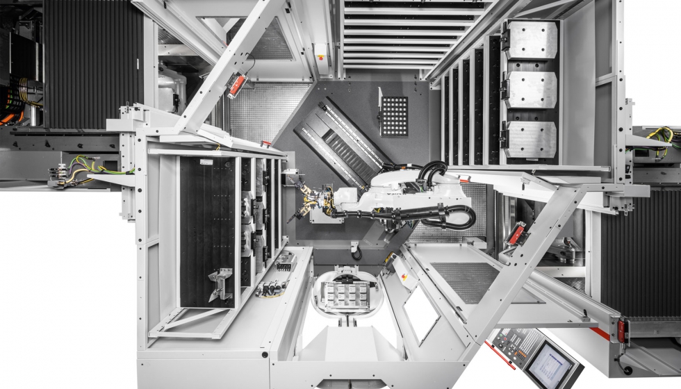 Vista desde arriba del sistema de robotizado RS 1 adaptado a dos centros de mecanizado C 22 U de Hermle a la izquierda y a la derecha  hasta tres...