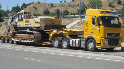 A truck for transportation of heavy machinery can be circular by the road needs a series of permits and authorizations