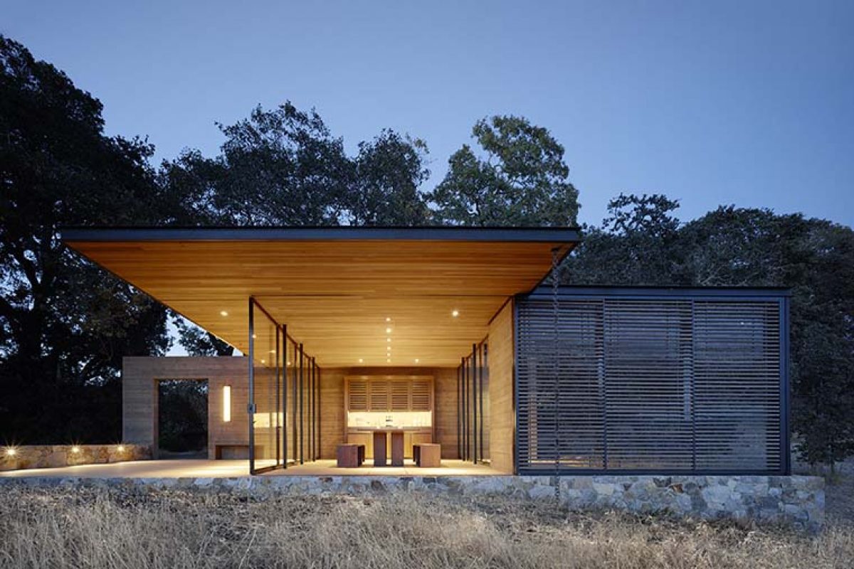 Quintessa pavilions among vineyards. A project by Walker Warner Architects in the Napa Valley