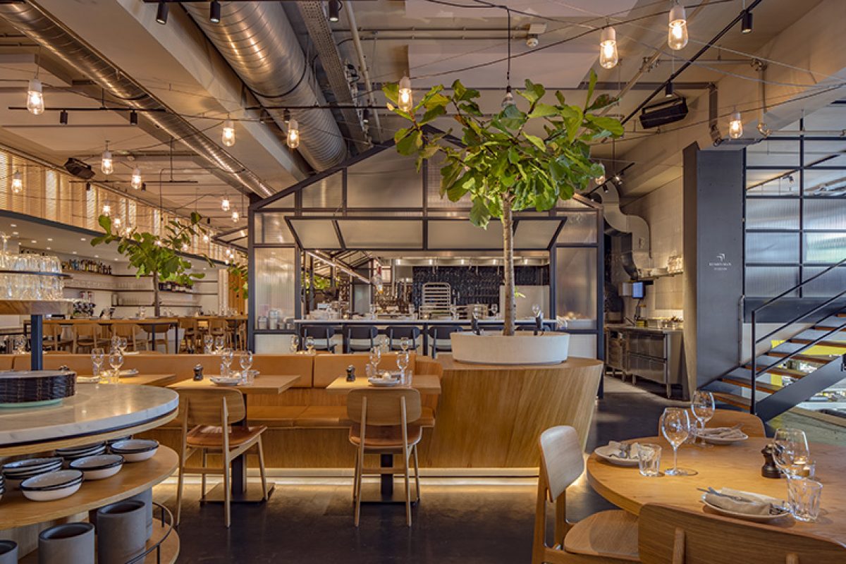 Concrete studio brings the Mediterranean outdoor patio atmosphere to the inside of Neni restaurant in a former Citron garage of...