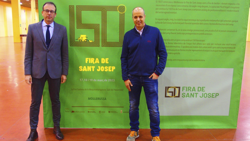 Marc Solsona y Xavier Roure posan delante del 'photocall' con el cartel y logotipo de la 150 Fira de Sant Josep