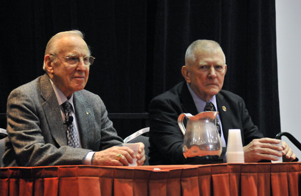 Jim Lovell (left), attentive, and Gene Kranz, with a look that sums up his personality, during the subsequent to the General session press conference...