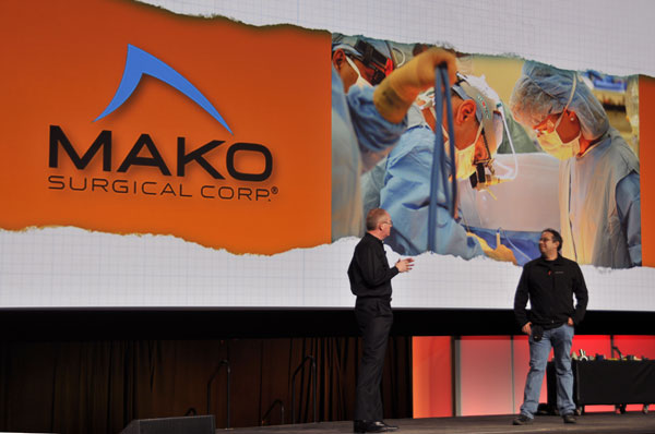 Mako Surgical Corp. To the right, Rony Abrovitz