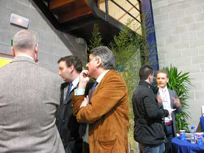 Jos Mara Muecas (brown jacket), event organizer, attends to customers during the Conference