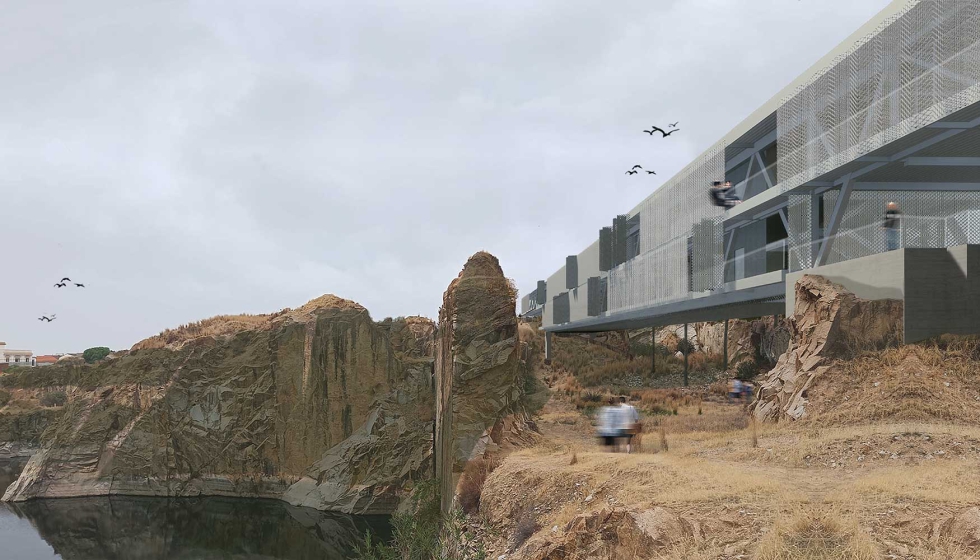 Vista del edificio-puente tras el 'muro' de granito