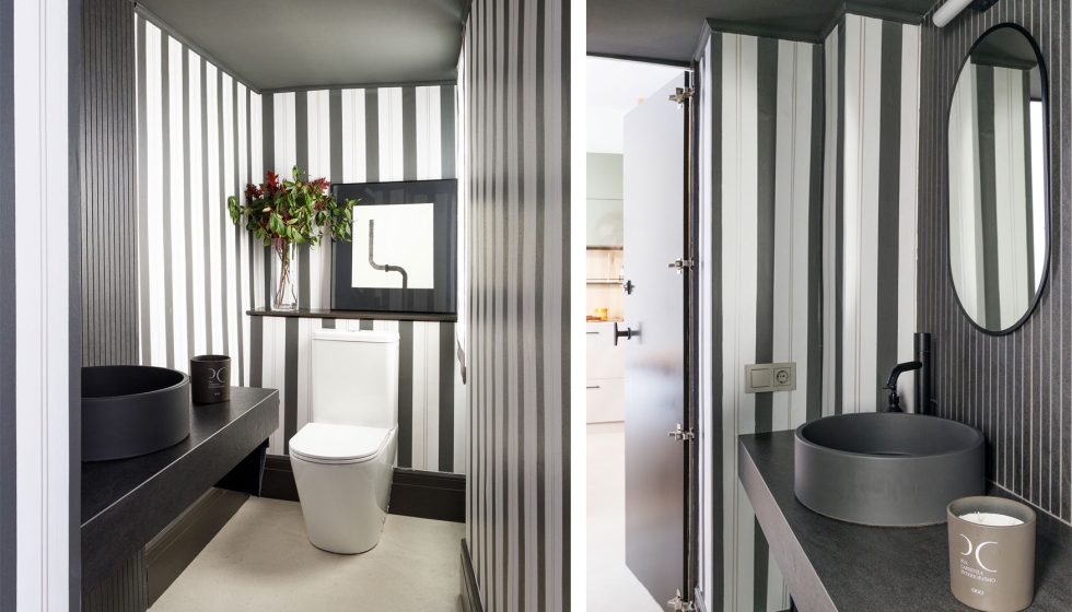 Con altura limitada, se ha configurado como una caja envolvente, jugando con el negro en el techo, una encimera...