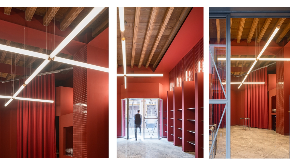 Las luminarias suspendidas enfatizan la verticalidad del local y establecen relaci�n con la estructura existente...