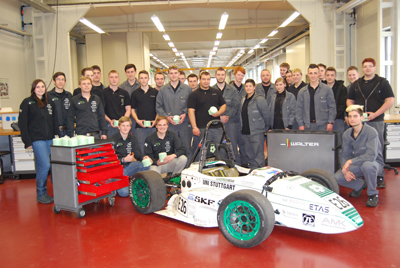 The team of Walter and members of the 'Green Team' with the car of this year of the ' Formula Student racing'