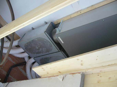Figure 3. Photograph of heat recovery Zehnder CA200 installed on the ceiling of the interior of the House