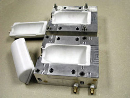 Two halves of the mould material (polycarbonate) PC mounted in cavities