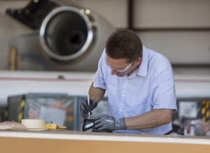 WEDNESDAY, JUNE 10, 2015 - Employees at Jet Aviation work with Hyflex gloves by Ansell. Photo by Jerry Naunheim Jr.