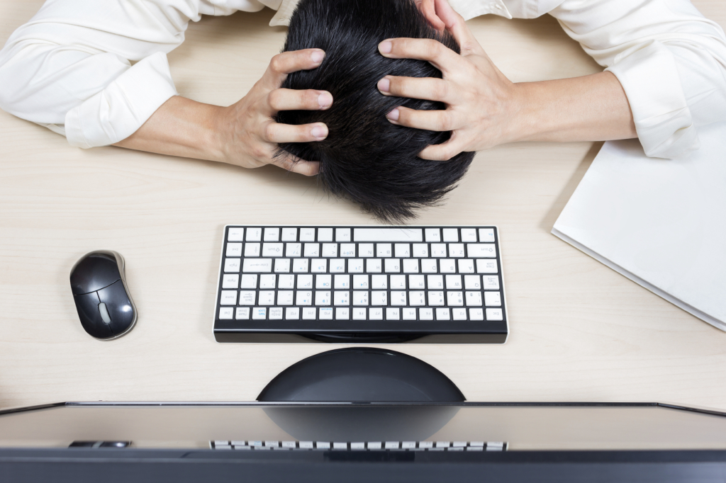 Tired & headache asian businessman or employee work overtime